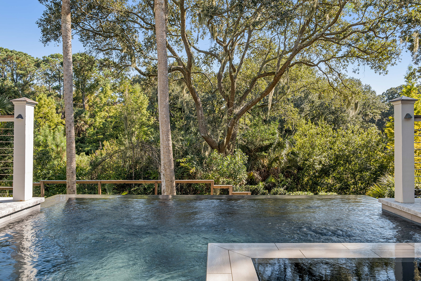 Infinity pool at a Kiawah Island, SC home, framed by live oaks and palmettos
